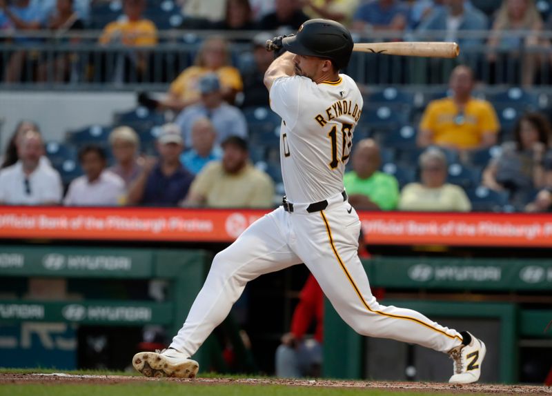 Sep 5, 2024; Pittsburgh, Pennsylvania, USA;  Pittsburgh Pirates left fielder Bryan Reynolds (10) hits a RBI single against the Washington Nationals during the second inning at PNC Park. Mandatory Credit: Charles LeClaire-Imagn Images