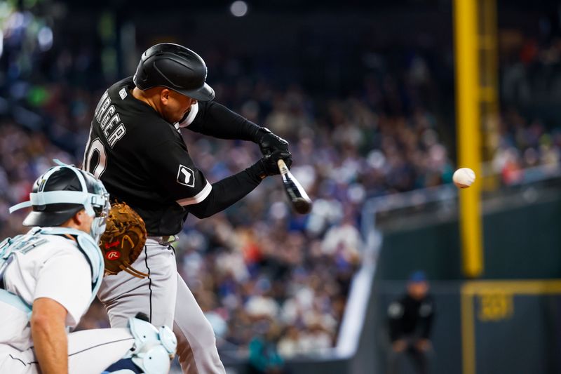 Jun 18, 2023; Seattle, Washington, USA; Chicago White Sox third baseman Jake Burger (30) hits a single against the Seattle Mariners during the third inning at T-Mobile Park. Mandatory Credit: Joe Nicholson-USA TODAY Sports