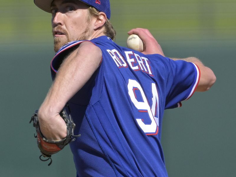 Feb 24, 2023; Surprise, Arizona, USA;  Texas Rangers starting relief pitcher Daniel Robers (94) throws to the plate in the fourth inning of a spring training game against the Kansas City Royals at Surprise Stadium in Surprise, AZ. Mandatory Credit: Jayne Kamin-Oncea-USA TODAY Sports