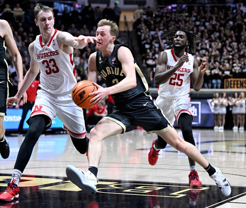 Jan 13, 2023; West Lafayette, Indiana, USA; Purdue Boilermakers guard Fletcher Loyer (2) runs into Nebraska Cornhuskers forward Oleg Kojenets (33) while driving toward the basket during the second half at Mackey Arena. Boilermakers won 73 to 55. Mandatory Credit: Marc Lebryk-USA TODAY Sports