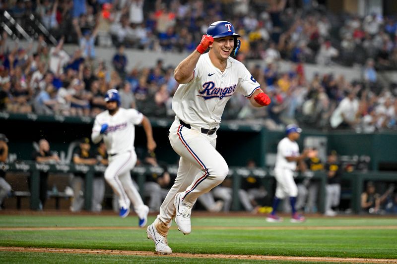Aug 21, 2024; Arlington, Texas, USA; Texas Rangers left fielder Wyatt Langford (36) celebrates after driving in the game winning run by pinch runner Ezequiel Duran (20) against the Pittsburgh Pirates during the ninth inning at Globe Life Field. Mandatory Credit: Jerome Miron-USA TODAY Sports