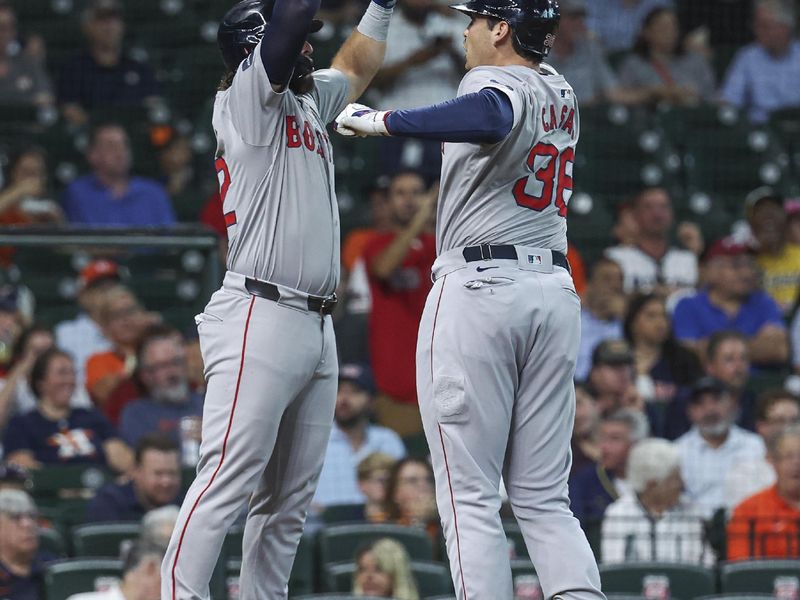 Aug 20, 2024; Houston, Texas, USA; Boston Red Sox first baseman Triston Casas (36) celebrates with right fielder Wilyer Abreu (52) after hitting a home run during the first inning against the Houston Astros at Minute Maid Park. Mandatory Credit: Troy Taormina-USA TODAY Sports