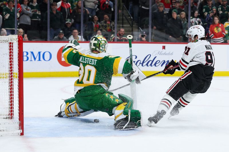 Jan 27, 2026; Saint Paul, Minnesota, USA; Chicago Blackhawks center Frank Nazar (91) misses a shot against Minnesota Wild goaltender Jesper Wallstedt (30) during a shootout at Grand Casino Arena. Mandatory Credit: Matt Krohn-Imagn Images