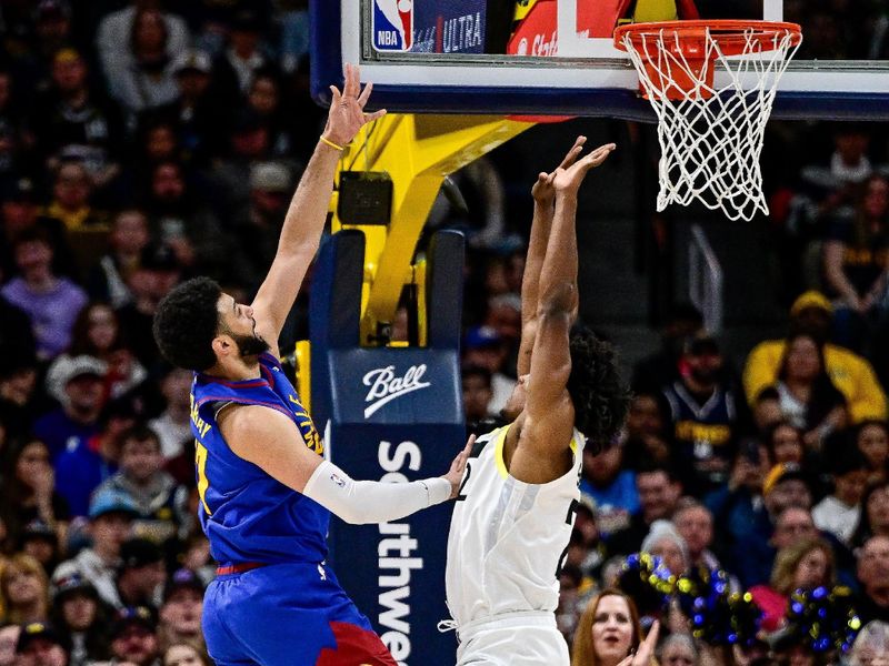 DENVER, COLORADO - MARCH 9: Jamal Murray #27 of the Denver Nuggets shoots past Collin Sexton #2 of the Utah Jazz in the second half at Ball Arena on March 9, 2024 in Denver, Colorado. (Photo by Dustin Bradford/Getty Images)