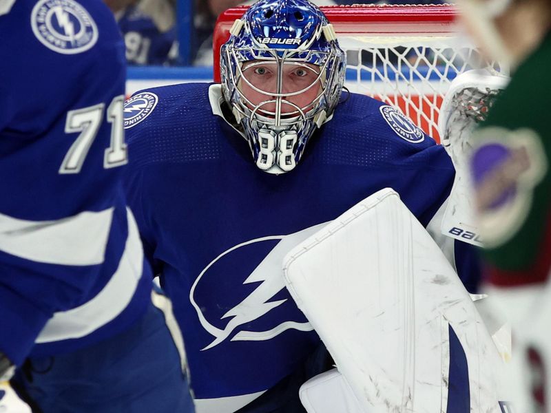 Jan 25, 2024; Tampa, Florida, USA; Tampa Bay Lightning goaltender Andrei Vasilevskiy (88) defends against the Arizona Coyotes during the second period at Amalie Arena. Mandatory Credit: Kim Klement Neitzel-USA TODAY Sports