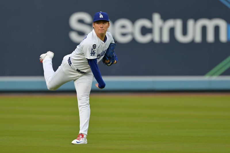 Apr 25, 2025; Los Angeles, California, USA;  Los Angeles Dodgers starting pitcher Yoshinobu Yamamoto (18) warms up prior to the game against the Pittsburgh Pirates at Dodger Stadium. Mandatory Credit: Jayne Kamin-Oncea-Imagn Images