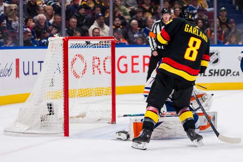 Nov 6, 2023; Vancouver, British Columbia, CAN; Vancouver Canucks forward Conor Garland (8) watches the shot from forward J.T. Miller (9) beat Edmonton Oilers goalie Stuart Skinner (74) in the third period at Rogers Arena. Mandatory Credit: Bob Frid-USA TODAY Sports