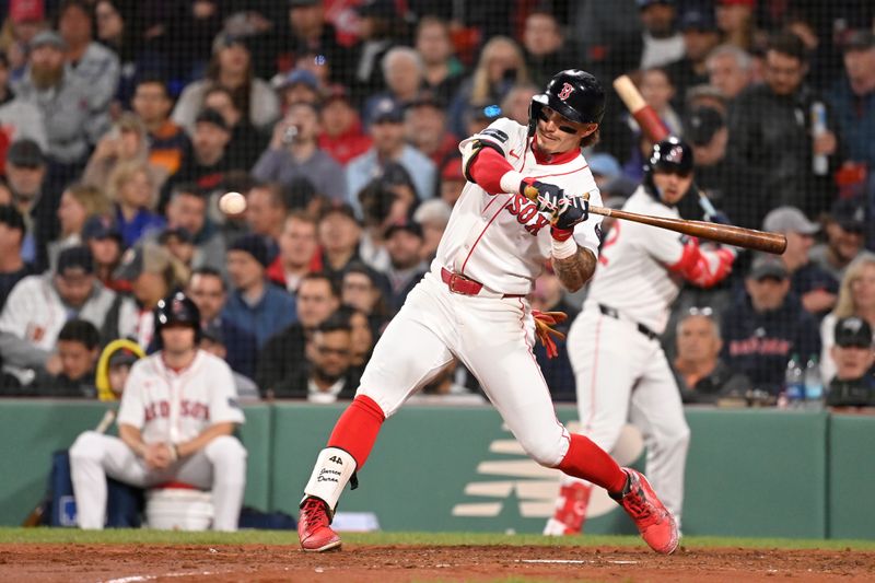 May 16, 2024; Boston, Massachusetts, USA;  Boston Red Sox center fielder Jarren Duran (16) hits a double against the Tampa Bay Rays  during the fifth inning at Fenway Park. Mandatory Credit: Eric Canha-USA TODAY Sports