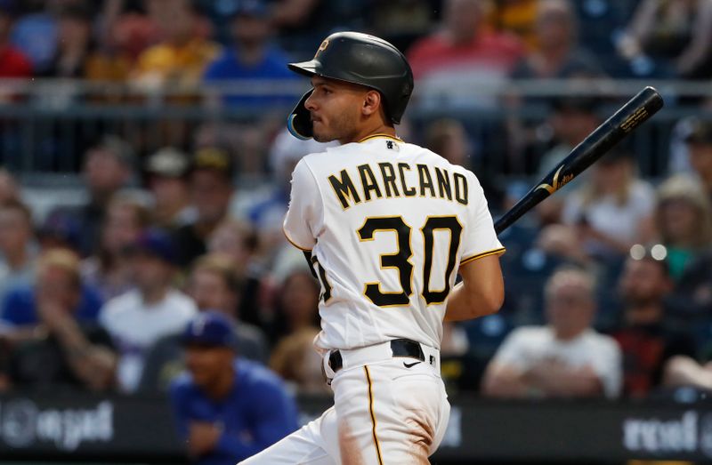 May 22, 2023; Pittsburgh, Pennsylvania, USA;  Pittsburgh Pirates shortstop Tucupita Marcano (30) hits a grand slam home run against the Texas Rangers during the seventh inning at PNC Park. Mandatory Credit: Charles LeClaire-USA TODAY Sports