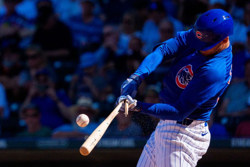 Mar 22, 2024; Mesa, Arizona, USA; Chicago Cubs outfielder Cody Bellinger (24) reacts as his bat breaks for a single in the sixth inning during a spring training game against the San Francisco Giants at Sloan Park. Mandatory Credit: Allan Henry-USA TODAY Sports