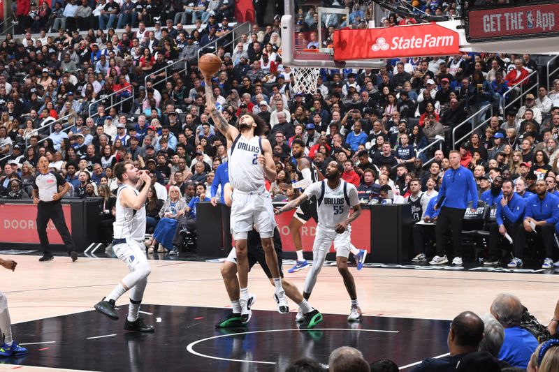 LOS ANGELES, CA - APRIL 23: Dereck Lively II #2 of the Dallas Mavericks grabs a rebound during the game against the LA Clippers during Round 1 Game 2 of the 2024 NBA Playoffs on April 23, 2024 at Crypto.Com Arena in Los Angeles, California. NOTE TO USER: User expressly acknowledges and agrees that, by downloading and/or using this Photograph, user is consenting to the terms and conditions of the Getty Images License Agreement. Mandatory Copyright Notice: Copyright 2024 NBAE (Photo by Andrew D. Bernstein/NBAE via Getty Images)