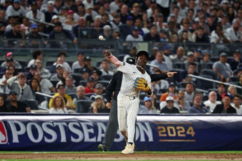 Oct 5, 2024; Bronx, New York, USA; New York Yankees third base Jazz Chisholm Jr. (13) throws the ball during the eighth inning against the Kansas City Royals during game one of the ALDS for the 2024 MLB Playoffs at Yankee Stadium. Mandatory Credit: Vincent Carchietta-Imagn Images