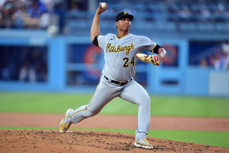 Jul 6, 2023; Los Angeles, California, USA; Pittsburgh Pirates starting pitcher Johan Oviedo (24) throws against the Los Angeles Dodgers during the second inning at Dodger Stadium. Mandatory Credit: Gary A. Vasquez-USA TODAY Sports