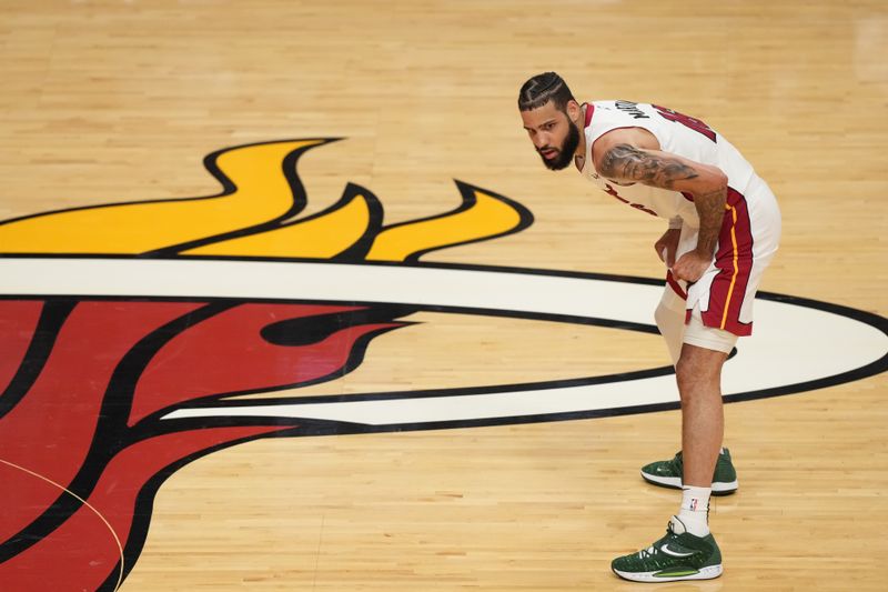 MIAMI, FL - MAY 21: Caleb Martin #16 of the Miami Heat looks on during the game against the Boston Celtics during the Eastern Conference Finals of the 2023 NBA Playoffs on May 21, 2023 at Miami-Dade Arena in Miami, Florida. NOTE TO USER: User expressly acknowledges and agrees that, by downloading and or using this Photograph, user is consenting to the terms and conditions of the Getty Images License Agreement. Mandatory Copyright Notice: Copyright 2023 NBAE (Photo by Eric Espada/NBAE via Getty Images)