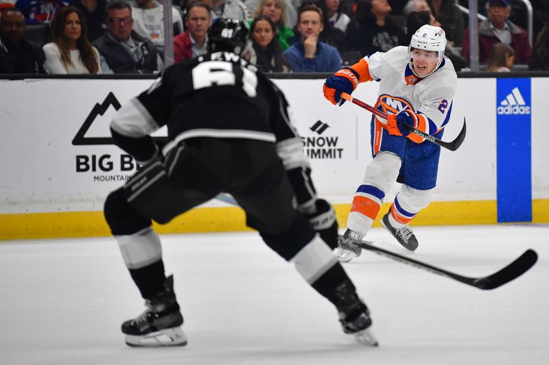 Mar 11, 2024; Los Angeles, California, USA; New York Islanders defenseman Mike Reilly (2) shoots on goal against the Los Angeles Kings during the third period at Crypto.com Arena. Mandatory Credit: Gary A. Vasquez-USA TODAY Sports