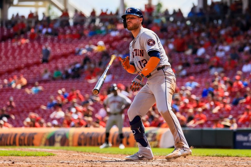 Sep 5, 2024; Cincinnati, Ohio, USA; Houston Astros outfielder Ben Gamel (12) flips his bat as he gets walked in the seventh inning against the Cincinnati Reds at Great American Ball Park. Mandatory Credit: Katie Stratman-Imagn Images
