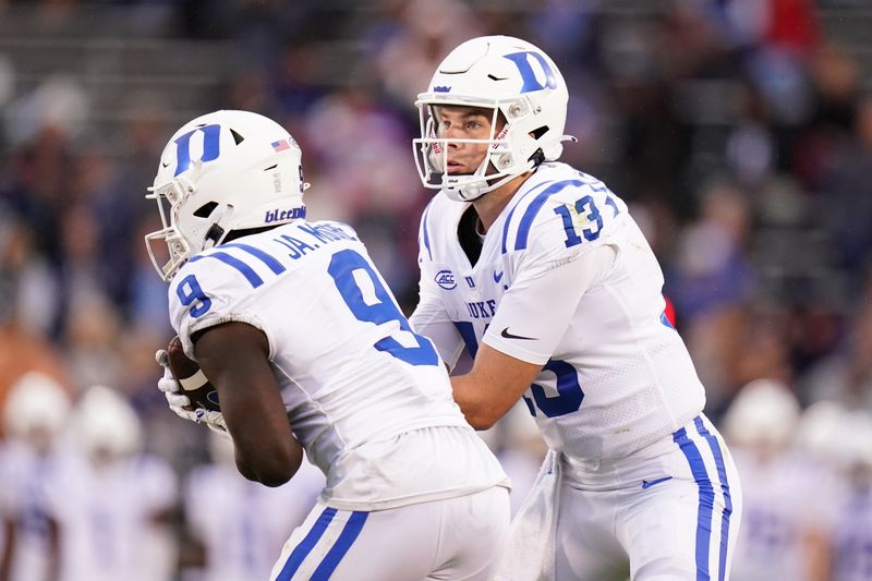 Sep 23, 2023; East Hartford, Connecticut, USA; Duke Blue Devils quarterback Riley Leonard (13) hands off the ball to running back Jaquez Moore (9) against the UConn Huskies in the second half at Rentschler Field at Pratt & Whitney Stadium. Mandatory Credit: David Butler II-USA TODAY Sports