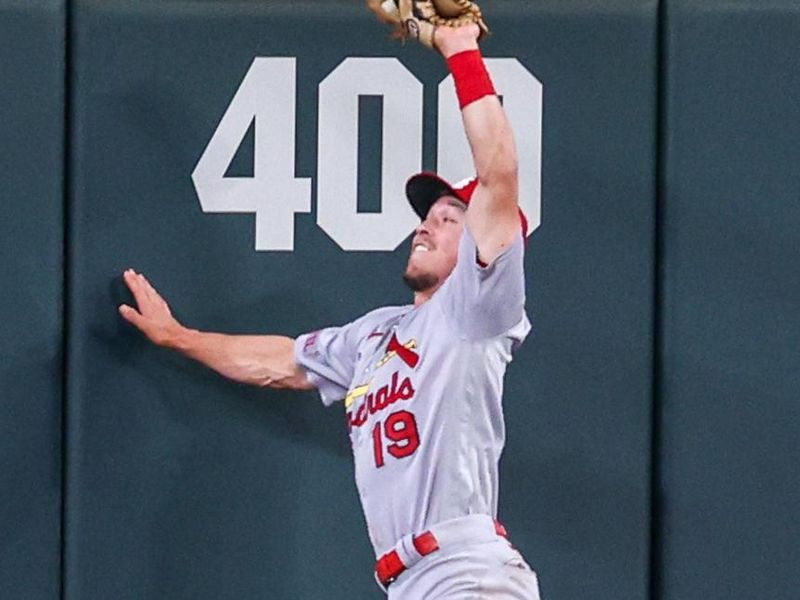 Sep 7, 2023; Atlanta, Georgia, USA; St. Louis Cardinals center fielder Tommy Edman (19) makes a leaping catch at the wall against the Atlanta Braves in the fifth inning at Truist Park. Mandatory Credit: Brett Davis-USA TODAY Sports