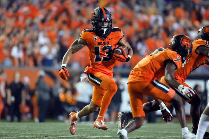 Oct 15, 2022; Corvallis, Oregon, USA; Oregon State Beavers wide receiver Jesiah Irish (13) runs the ball during the second half Washington State Cougars at Reser Stadium. Mandatory Credit: Soobum Im-USA TODAY Sports