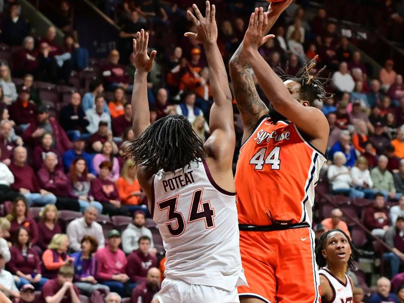 Mar 1, 2025; Blacksburg, Virginia, USA;  Syracuse Orange center Eddie Lampkin Jr. (44) shoots a shot over Virginia Tech Hokies forward Mylyjael Poteat (34) during the first half at Cassell Coliseum. Mandatory Credit: Brian Bishop-Imagn Images