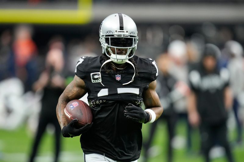 Las Vegas Raiders wide receiver Davante Adams works out prior to an NFL football game against the Denver Broncos, Sunday, Jan. 7, 2024 in Las Vegas. (AP Photo/John Locher)