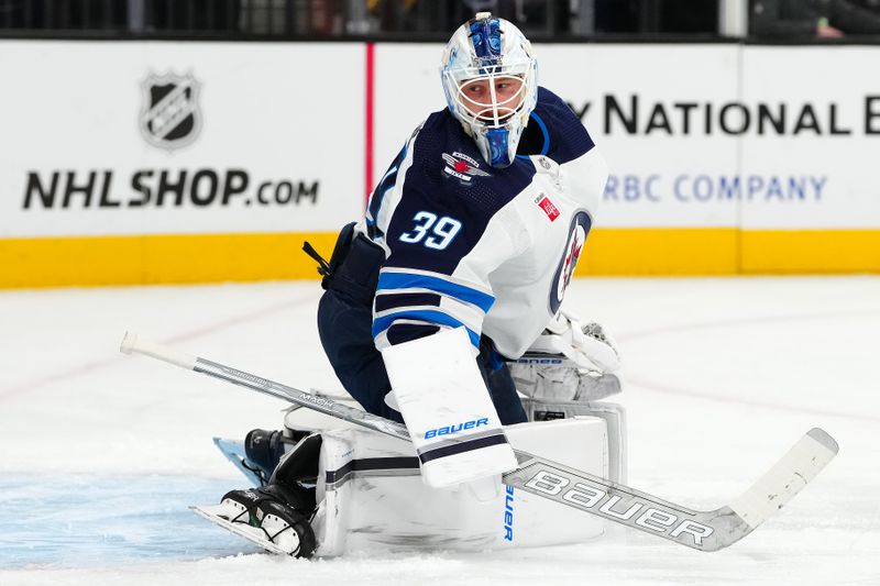 Nov 2, 2023; Las Vegas, Nevada, USA; Winnipeg Jets goaltender Laurent Brossoit (39) warms up before a game against the Vegas Golden Knights at T-Mobile Arena. Mandatory Credit: Stephen R. Sylvanie-USA TODAY Sports