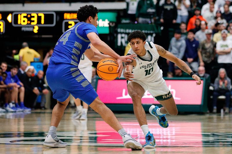 Jan 16, 2024; Fort Collins, Colorado, USA; Air Force Falcons guard Jeffrey Mills (24) controls the ball as Colorado State Rams guard Nique Clifford (10) defends in the second half at Moby Arena. Mandatory Credit: Isaiah J. Downing-USA TODAY Sports