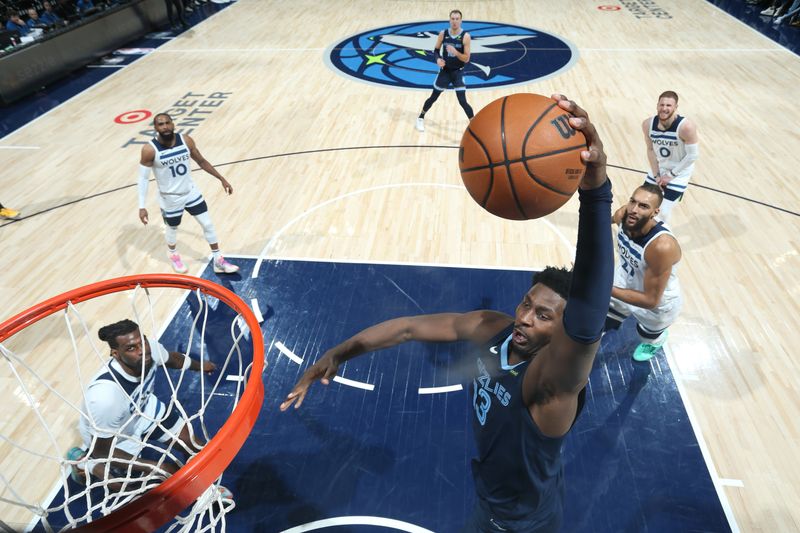 MINNEAPOLIS, MN -  JANUARY 11: Jaren Jackson Jr. #13 of the Memphis Grizzlies dunks the ball during the game against the Minnesota Timberwolves on January 11, 2025 at Target Center in Minneapolis, Minnesota. NOTE TO USER: User expressly acknowledges and agrees that, by downloading and or using this Photograph, user is consenting to the terms and conditions of the Getty Images License Agreement. Mandatory Copyright Notice: Copyright 2025 NBAE (Photo by David Sherman/NBAE via Getty Images)