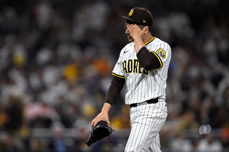 Jun 20, 2024; San Diego, California, USA; San Diego Padres relief pitcher Yuki Matsui (1) walks to the dugout after a pitching change during the seventh inning against the Milwaukee Brewers at Petco Park. Mandatory Credit: Orlando Ramirez-USA TODAY Sports