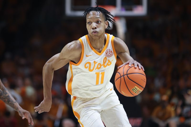 Mar 1, 2025; Knoxville, Tennessee, USA; Tennessee Volunteers guard Jordan Gainey (11) moves the ball against the Alabama Crimson Tide during the first half at Thompson-Boling Arena at Food City Center. Mandatory Credit: Randy Sartin-Imagn Images