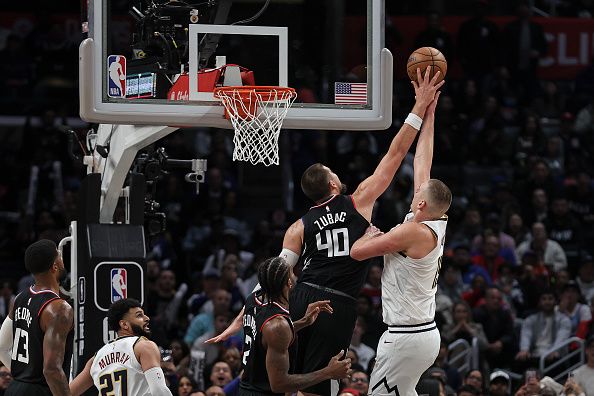 LOS ANGELES, CALIFORNIA - DECEMBER 06: Ivica Zubac #40 of the LA Clippers blocks a shot from Nikola Jokic #15 of the Denver Nuggets during the second half a game at Crypto.com Arena on December 06, 2023 in Los Angeles, California. NOTE TO USER: User expressly acknowledges and agrees that, by downloading and or using this photograph, User is consenting to the terms and conditions of the Getty Images License Agreement.  (Photo by Michael Owens/Getty Images)