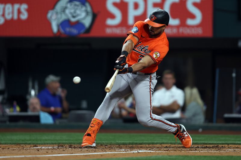 Jul 20, 2024; Arlington, Texas, USA; Baltimore Orioles designated hitter Anthony Santander (25) drives in a run with a single against the Texas Rangers in the second inning at Globe Life Field. Mandatory Credit: Tim Heitman-USA TODAY Sports