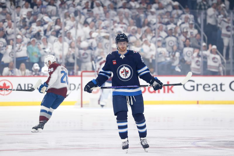 Apr 30, 2024; Winnipeg, Manitoba, CAN; Winnipeg Jets fans celebrate the first period goal by Winnipeg Jets left wing Kyle Connor (81) against the Colorado Avalanche in game five of the first round of the 2024 Stanley Cup Playoffs at Canada Life Centre. Mandatory Credit: James Carey Lauder-USA TODAY Sports