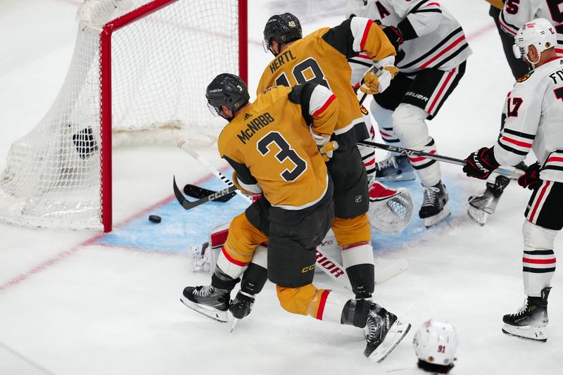 Apr 16, 2024; Las Vegas, Nevada, USA; Vegas Golden Knights defenseman Brayden McNabb (3) scores a goal against the Chicago Blackhawks during the second period at T-Mobile Arena. Mandatory Credit: Stephen R. Sylvanie-USA TODAY Sports