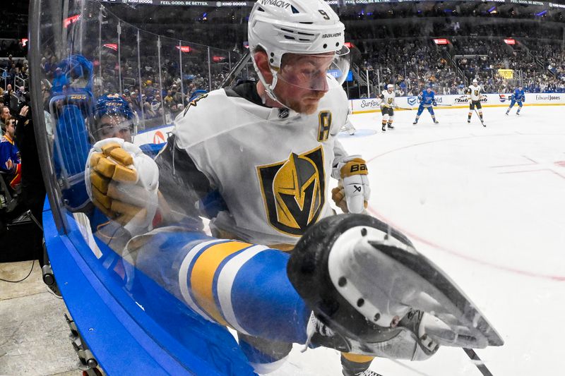 Jan 2, 2026; St. Louis, Missouri, USA; Vegas Golden Knights center Jack Eichel (9) checks St. Louis Blues right wing Jordan Kyrou (25) during the second period at Enterprise Center. Mandatory Credit: Jeff Curry-Imagn Images