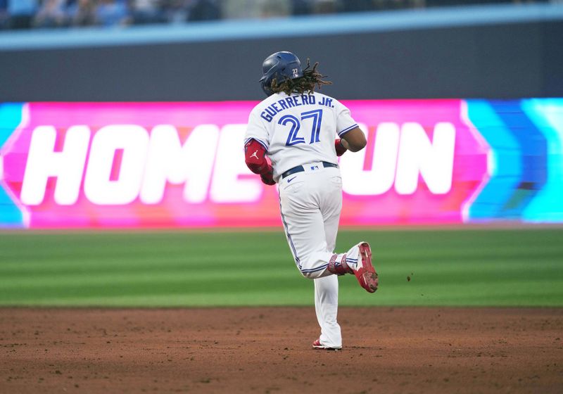 Jun 29, 2023; Toronto, Ontario, CAN; Toronto Blue Jays designated hitter Vladimir Guerrero Jr. (27) runs the bases after hitting a two run home run against the San Francisco Giants during the sixth inning at Rogers Centre. Mandatory Credit: Nick Turchiaro-USA TODAY Sports