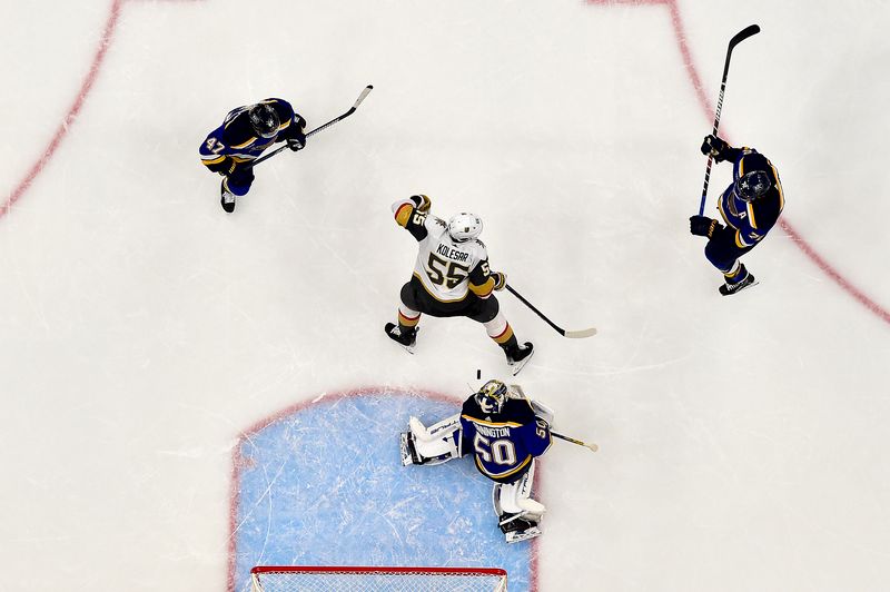 Dec 6, 2023; St. Louis, Missouri, USA;  Vegas Golden Knights right wing Keegan Kolesar (55) scores against St. Louis Blues goaltender Jordan Binnington (50) during the second period at Enterprise Center. Mandatory Credit: Jeff Curry-USA TODAY Sports