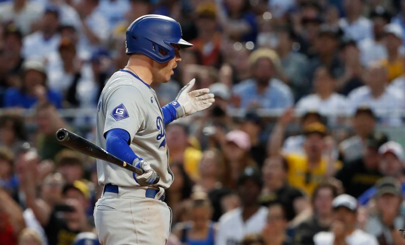 Jun 4, 2024; Pittsburgh, Pennsylvania, USA;  Los Angeles Dodgers first baseman Freddie Freeman (5) reacts after being called out on strikes against the Pittsburgh Pirates during the eighth inning at PNC Park. The Pirates shutout the Dodgers 1-0. Mandatory Credit: Charles LeClaire-USA TODAY Sports