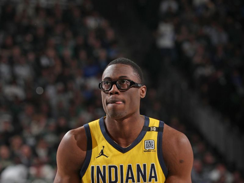 MILWAUKEE, WI - APRIL 21: Jalen Smith #25 of the Indiana Pacers shoots a free throw during the game against the Milwaukee Bucks during Round 1 Game 1 of the 2024 NBA Playoffs on April 21, 2024 at the Fiserv Forum Center in Milwaukee, Wisconsin. NOTE TO USER: User expressly acknowledges and agrees that, by downloading and or using this Photograph, user is consenting to the terms and conditions of the Getty Images License Agreement. Mandatory Copyright Notice: Copyright 2024 NBAE (Photo by Gary Dineen/NBAE via Getty Images).