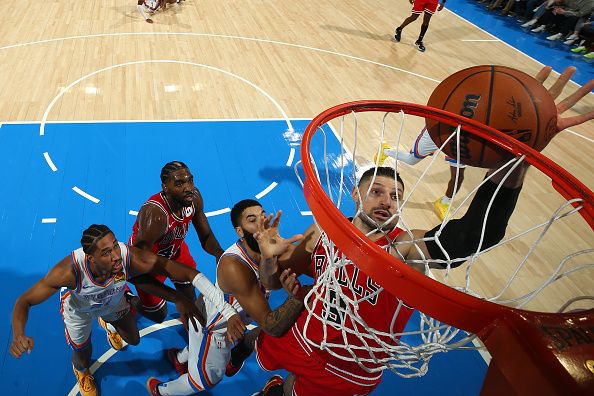 OKLAHOMA CITY, OK - NOVEMBER 22:  Nikola Vucevic #9 of the Chicago Bulls grabs a rebound during the game against the Oklahoma City Thunder on November 22, 2023 at Paycom Arena in Oklahoma City, Oklahoma. NOTE TO USER: User expressly acknowledges and agrees that, by downloading and or using this photograph, User is consenting to the terms and conditions of the Getty Images License Agreement. Mandatory Copyright Notice: Copyright 2023 NBAE (Photo by Zach Beeker/NBAE via Getty Images)