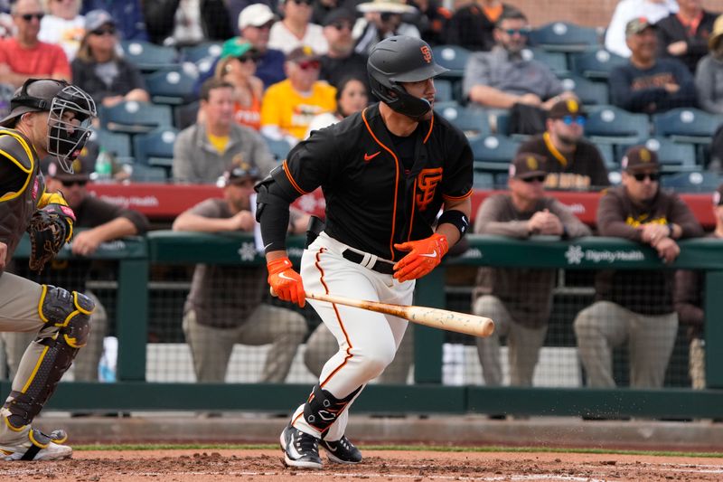 Feb 28, 2023; Scottsdale, Arizona, USA; San Francisco Giants right fielder Michael Conforto (8) hits an RBI grounder against the San Diego Padres in the third Credit: Rick Scuteri-USA TODAY Sports