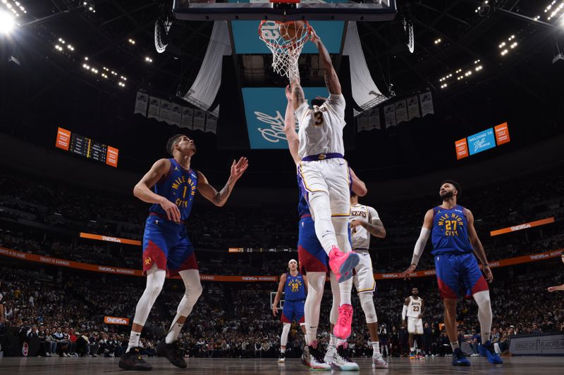 DENVER, CO - APRIL 20: Anthony Davis #3 of the Los Angeles Lakers dunks the ball during the game against the Denver Nuggets during Round 1 Game 1 of the 2024 NBA Playoffs on April 20, 2024 at the Ball Arena in Denver, Colorado. NOTE TO USER: User expressly acknowledges and agrees that, by downloading and/or using this Photograph, user is consenting to the terms and conditions of the Getty Images License Agreement. Mandatory Copyright Notice: Copyright 2024 NBAE (Photo by Garrett Ellwood/NBAE via Getty Images)