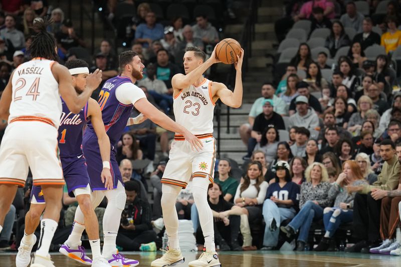 SAN ANTONIO, TX - MARCH 25: Zach Collins #23 of the San Antonio Spurs handles the ball during the game against the Phoenix Suns on March 25, 2024 at the AT&T Center in San Antonio, Texas. NOTE TO USER: User expressly acknowledges and agrees that, by downloading and or using this photograph, user is consenting to the terms and conditions of the Getty Images License Agreement. Mandatory Copyright Notice: Copyright 2024 NBAE (Photos by Jesse D. Garrabrant/NBAE via Getty Images)