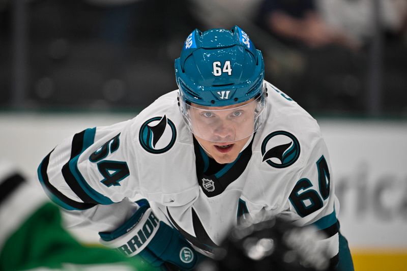 Oct 15, 2024; Dallas, Texas, USA; San San Jose Sharks center Mikael Granlund (64) looks on from the face-off circle during the first period against the Dallas Stars at the American Airlines Center. Mandatory Credit: Jerome Miron-Imagn Images