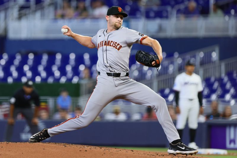 Apr 17, 2024; Miami, Florida, USA; San Francisco Giants starting pitcher Keaton Winn (67) delivers a pitch against the Miami Marlins during the first inning at loanDepot Park. Mandatory Credit: Sam Navarro-USA TODAY Sports