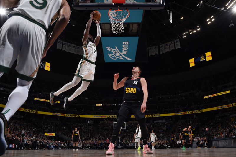 DENVER, CO - MARCH 7: Jaylen Brown #7 of the Boston Celtics dunks the ball during the game Denver Nuggets on March 7, 2024 at the Ball Arena in Denver, Colorado. NOTE TO USER: User expressly acknowledges and agrees that, by downloading and/or using this Photograph, user is consenting to the terms and conditions of the Getty Images License Agreement. Mandatory Copyright Notice: Copyright 2024 NBAE (Photo by Garrett Ellwood/NBAE via Getty Images)