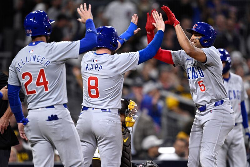 Apr 9, 2024; San Diego, California, USA; Chicago Cubs third baseman Christopher Morel (5) celebrates with left fielder Ian Happ (8) and center fielder Cody Bellinger (24) after hitting a grand slam home run during the fifth inning against the San Diego Padres at Petco Park. Mandatory Credit: Orlando Ramirez-USA TODAY Sports