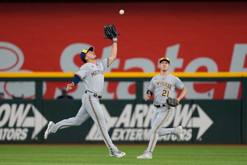 Aug 20, 2023; Arlington, Texas, USA; Milwaukee Brewers center fielder Tyrone Taylor (15) catches the fly out hit by Texas Rangers catcher Mitch Garver (not shown) in front of right fielder Mark Canha (21) during the first inning at Globe Life Field. Mandatory Credit: Jim Cowsert-USA TODAY Sports