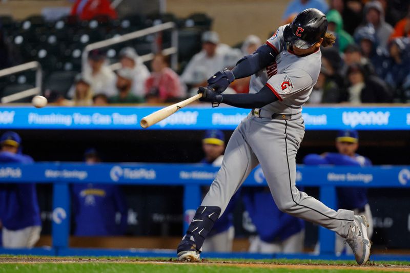 Sep 19, 2025; Minneapolis, Minnesota, USA; Cleveland Guardians catcher Bo Naylor (23) hits a two-run single against the Minnesota Twins in the first inning at Target Field. Mandatory Credit: Bruce Kluckhohn-Imagn Images