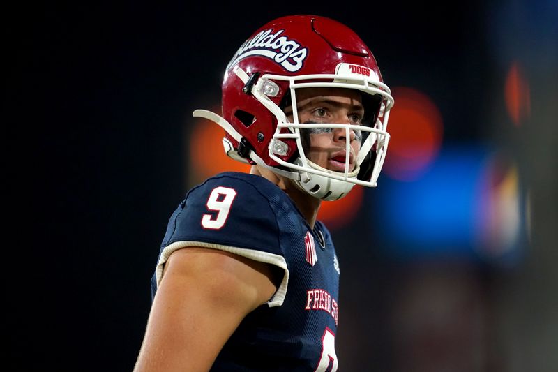 Sep 24, 2021; Fresno, California, USA; Fresno State Bulldogs quarterback Jake Haener (9) stands on the field during a timeout against the UNLV Rebels in the fourth quarter at Bulldog Stadium. Mandatory Credit: Cary Edmondson-USA TODAY Sports